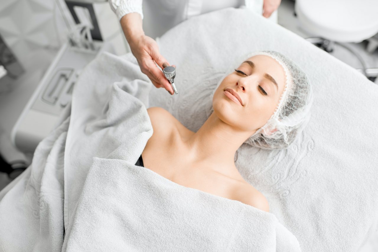 Client relaxing during a hydrating facial treatment